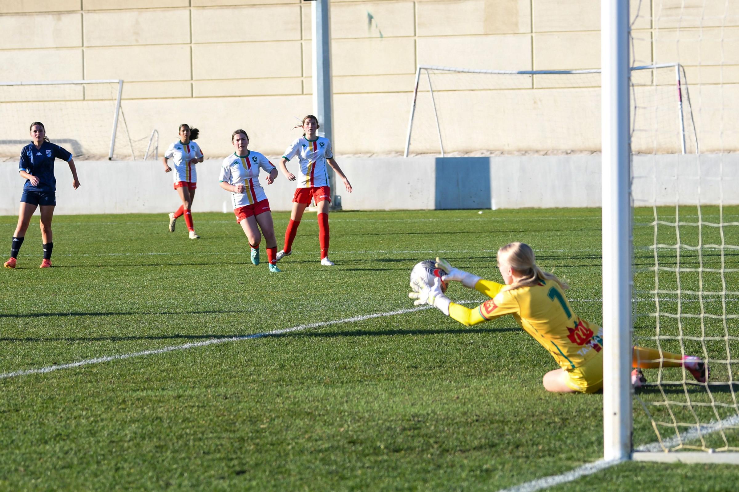 Ebony Pitt and Amelie Millar in action for the Under 15 State team in 2024.