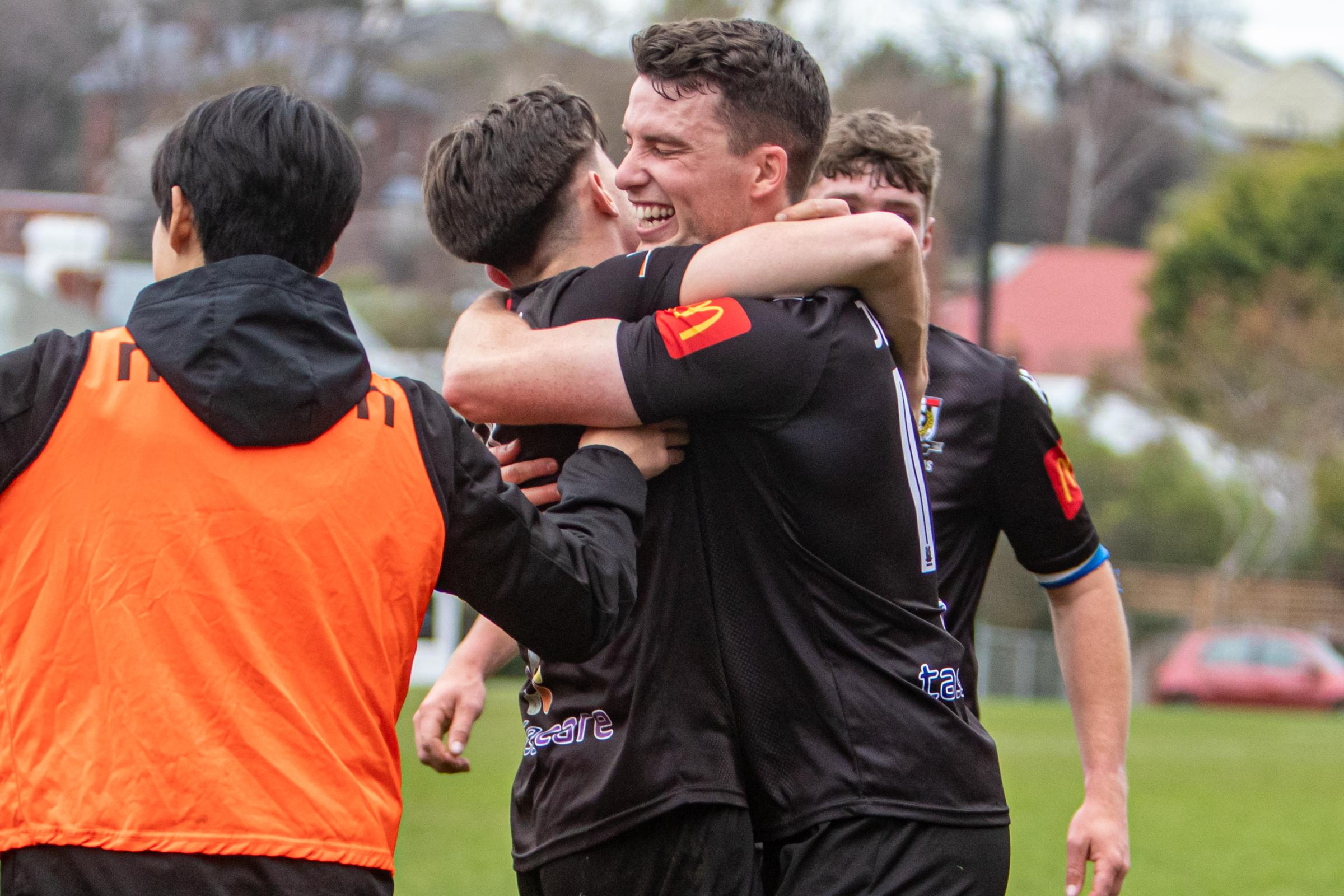 Launceston City captain Will Humphrey celebrates with goal-scorer Angus Taylor. Picture by Jamie Richardson.jpg