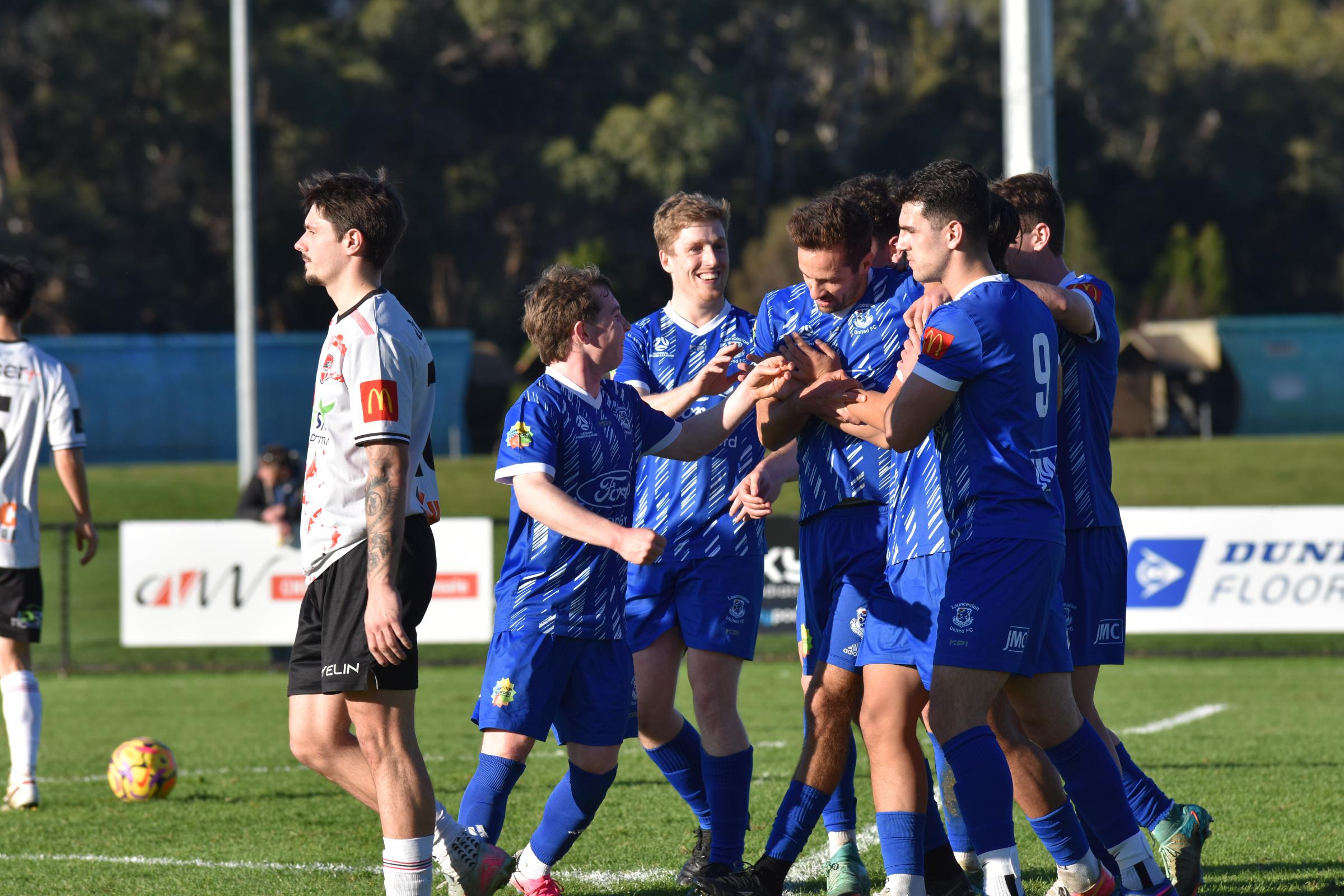 Launceston United players celebrate a goal in their 3-1 win against Ulverstone. Picture by Heather Reading