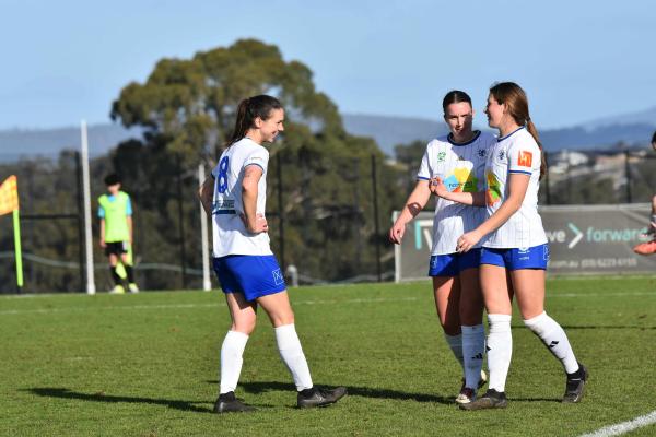 Launceston United goalscorer Dani Gunton celebrates with Abbie Chugg and Angel Ikeda in the win against Kingborough. Picture by Heather Reading