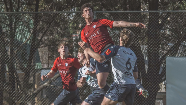 South Hobart goal-scorer Kobe Kemp climbs above Kingborough's Hugo Schwarz. Picture by Nikki Long