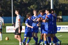 Launceston United players celebrate a goal in their 3-1 win against Ulverstone. Picture by Heather Reading